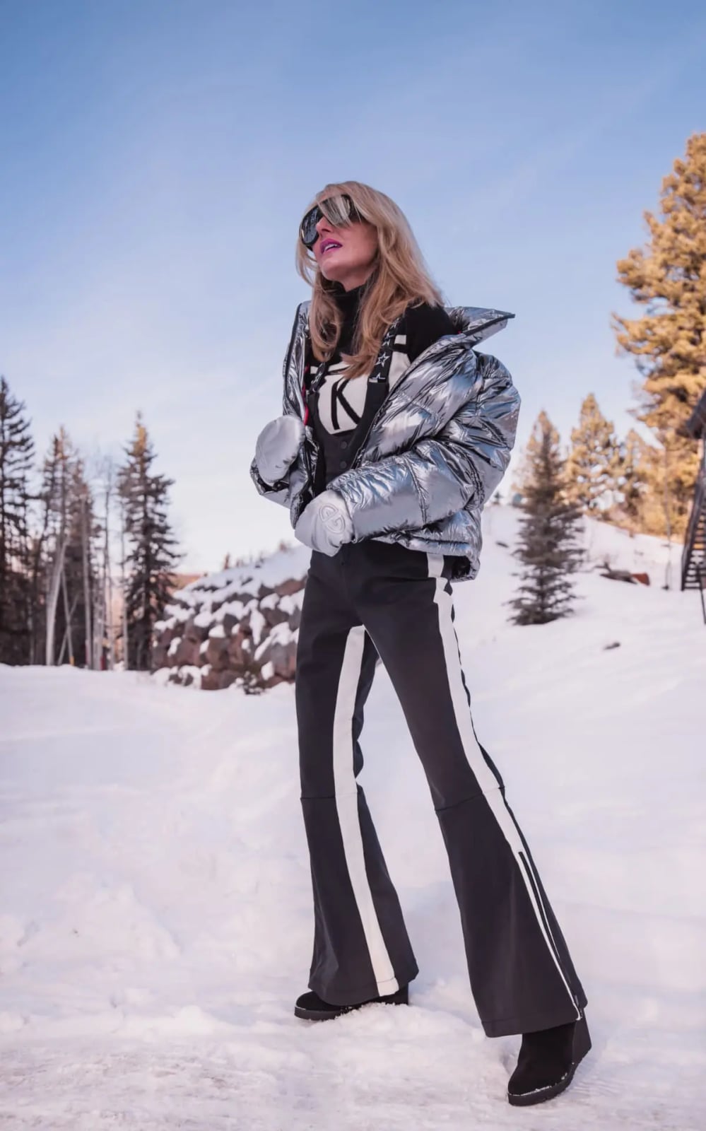 Metallic silver puffer jacket with gray flared trousers Metallic silver puffer jacket with gray flared trousers — Ski Trip Outfits 2027