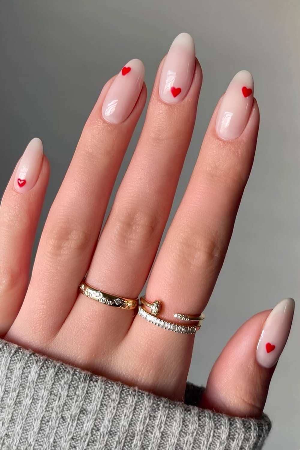 Medium Almond Sheer Nude With Scattered Red Hearts Medium Almond Sheer Nude With Scattered Red Hearts — Small Heart Nails 2027