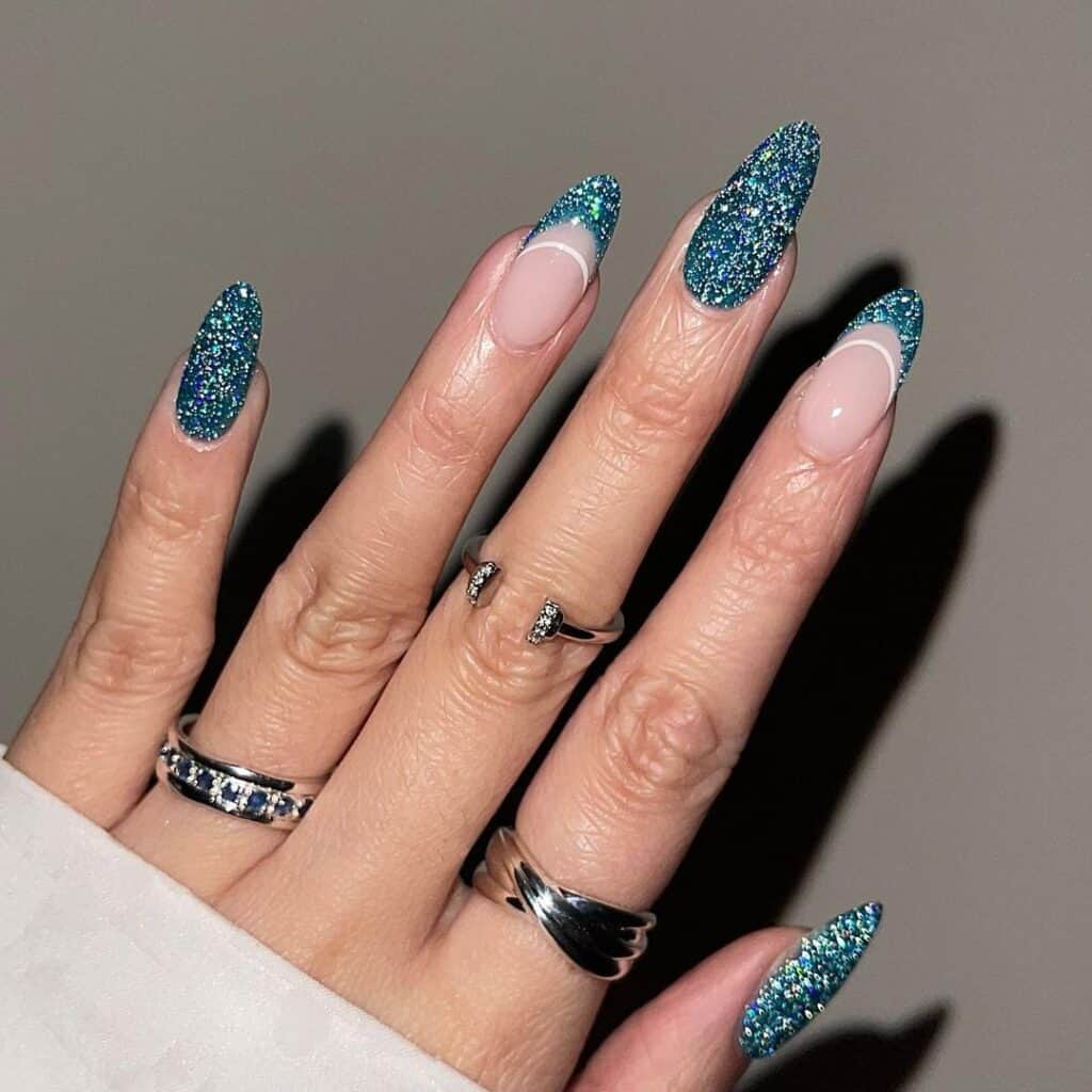 Long Almond Blue Glitter French Tips, Close-Up Take Long Almond Blue Glitter French Tips, Close-Up Take — Sparkly New Years Nails 2027