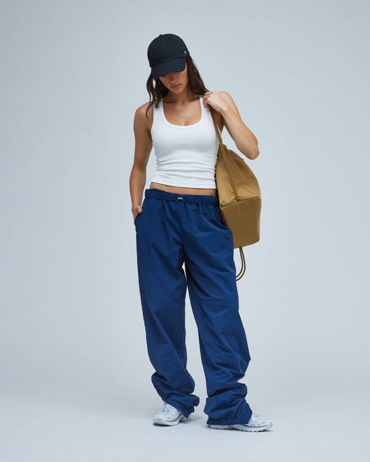 White tank top with oversized blue sweatpants, Light Gray Sneakers White tank top with oversized blue sweatpants, Light Gray Sneakers — Sporty Athletic Outfits 2027