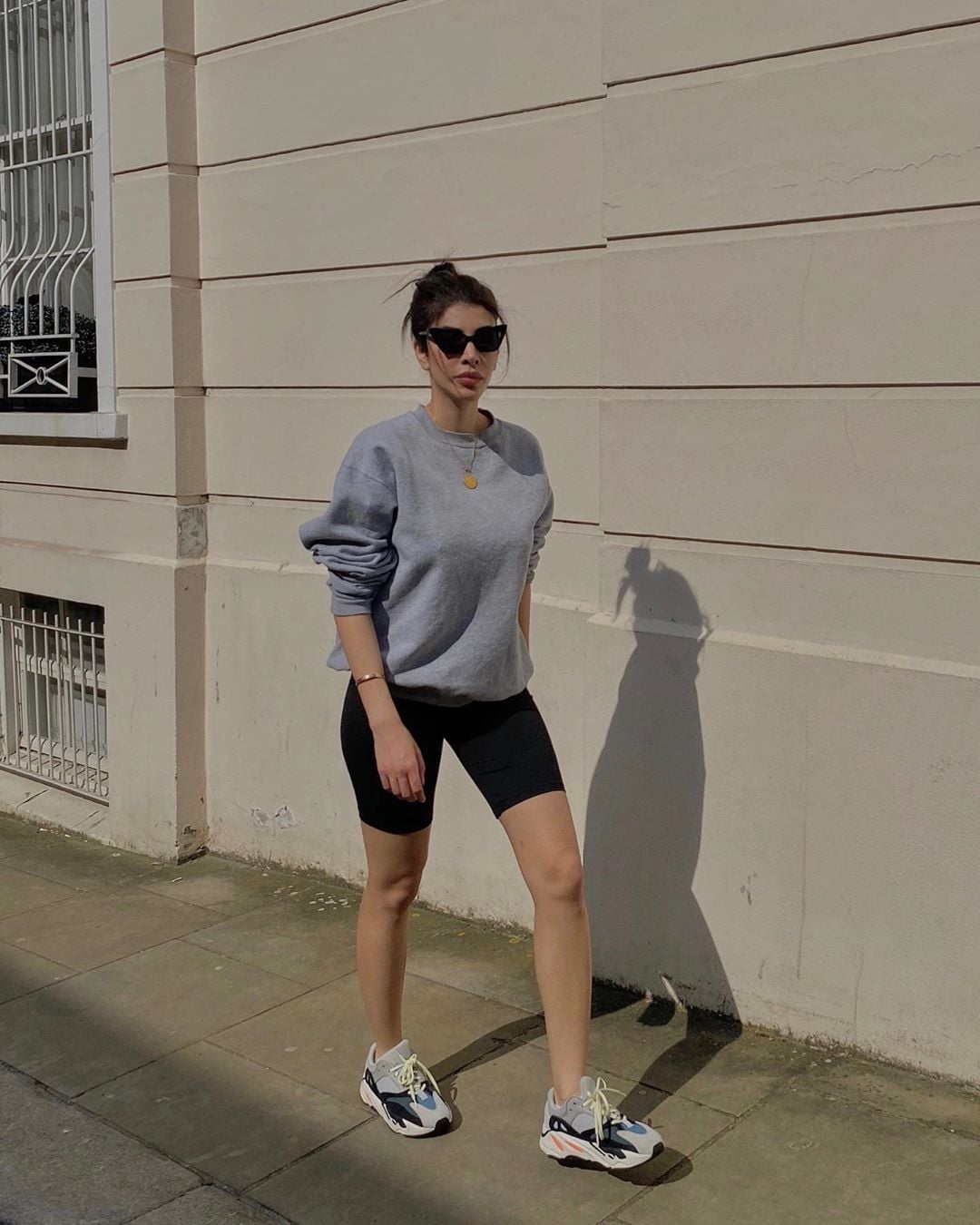 Gray sweatshirt with black bike shorts Gray sweatshirt with black bike shorts — Sporty Athletic Outfits 2027