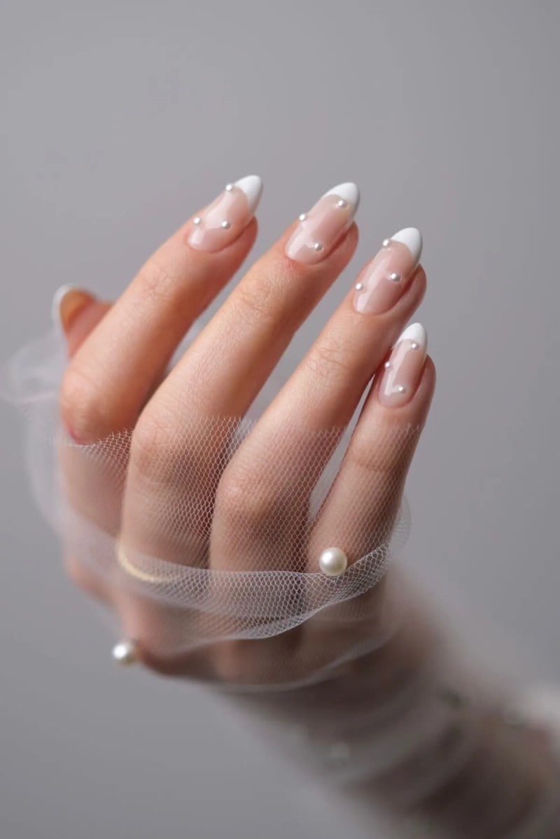 Pearl Accented Sheer Nude French Almond Nails Pearl Accented Sheer Nude French Almond Nails — Spring Wedding Nails 2027