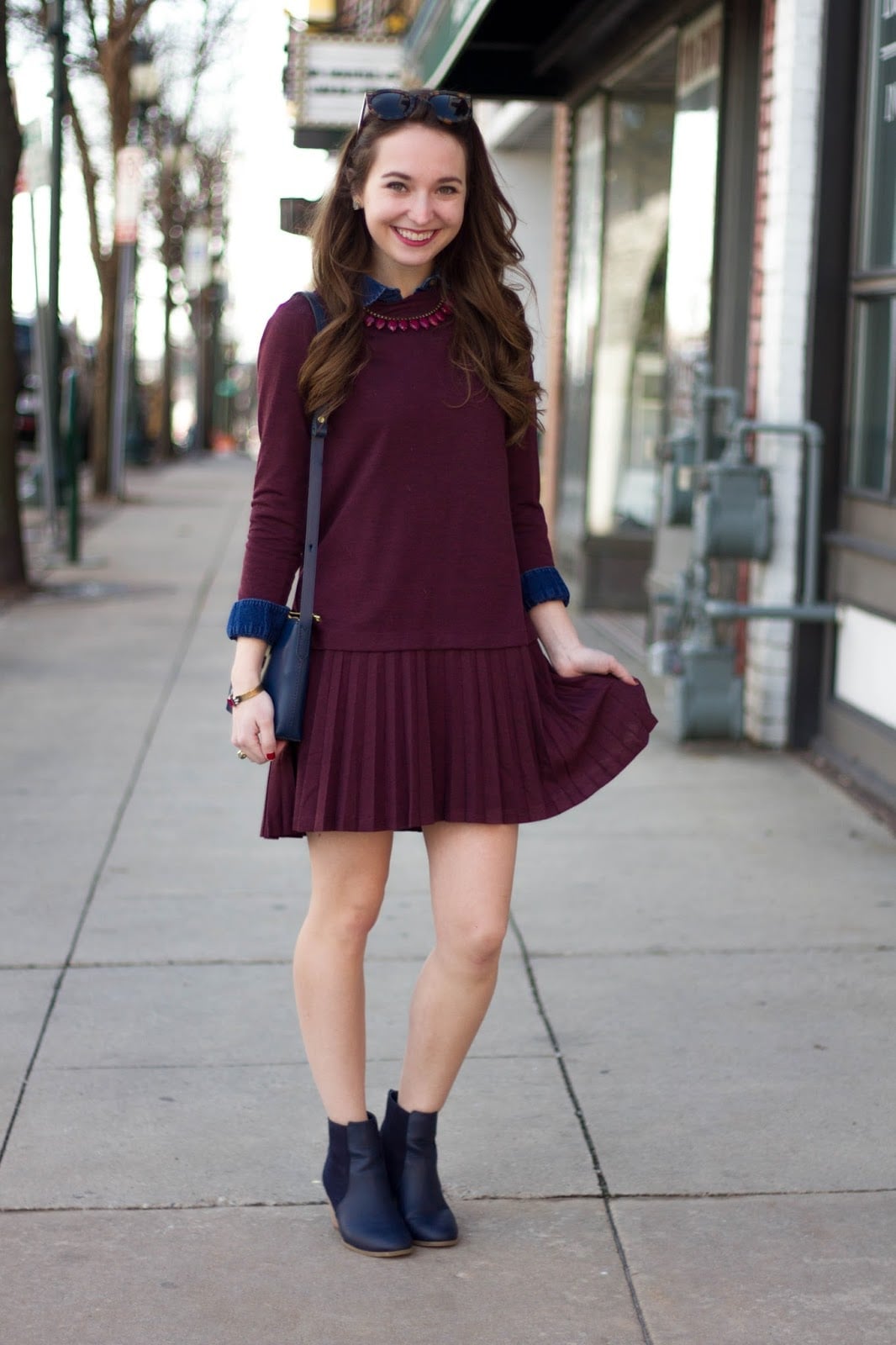 Burgundy Pleated Dress with Navy Accents Burgundy Pleated Dress with Navy Accents — Thanksgiving Dinner Outfits 2026