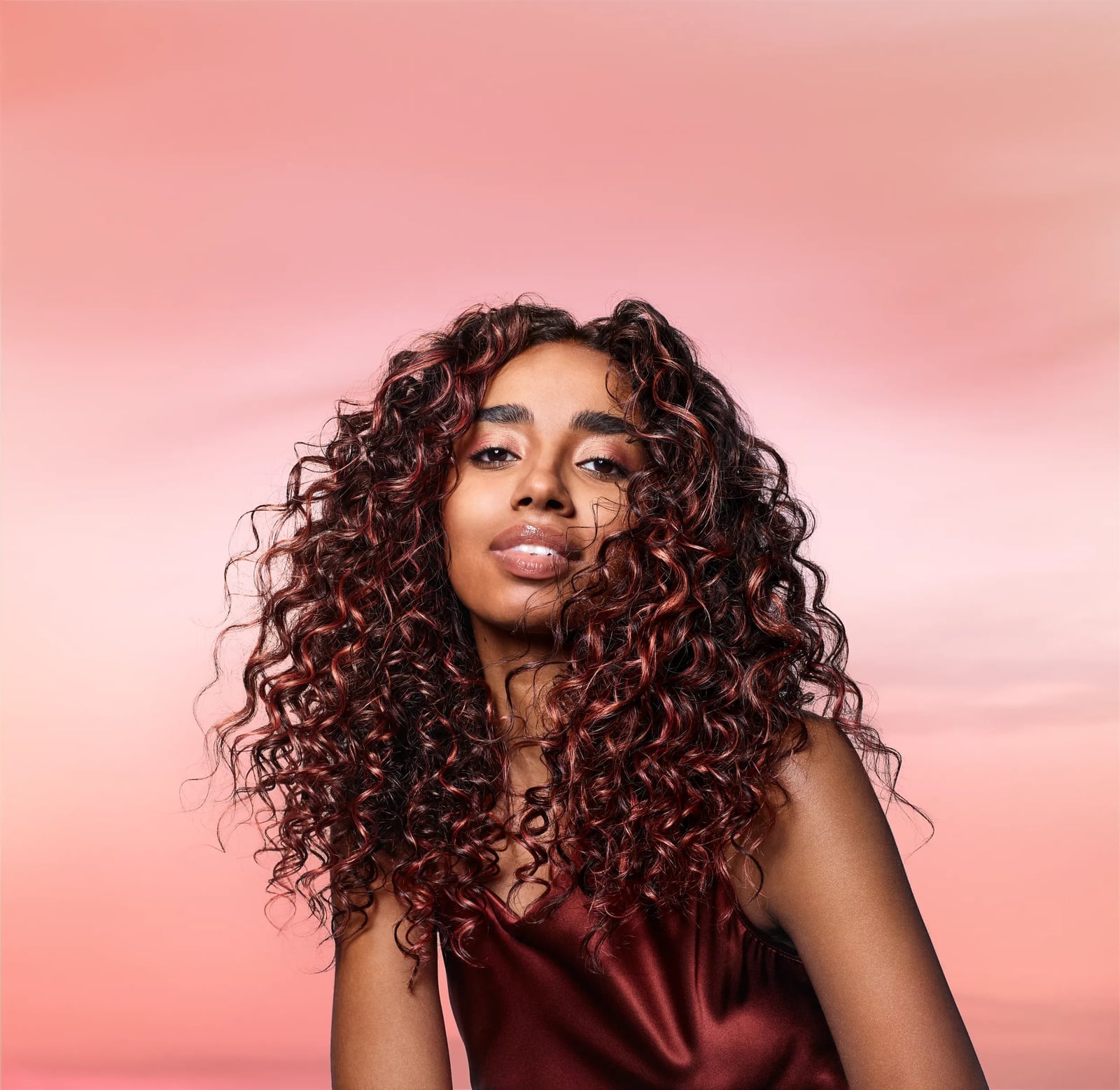 Collarbone Spiral Curls With Auburn Highlights Collarbone Spiral Curls With Auburn Highlights — Tight Curls 2027