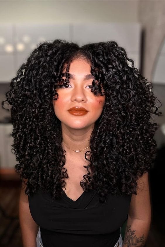 Collarbone Layered Cut With Subtle Highlights Collarbone Layered Cut With Subtle Highlights — Tight Curly Hairstyles 2027