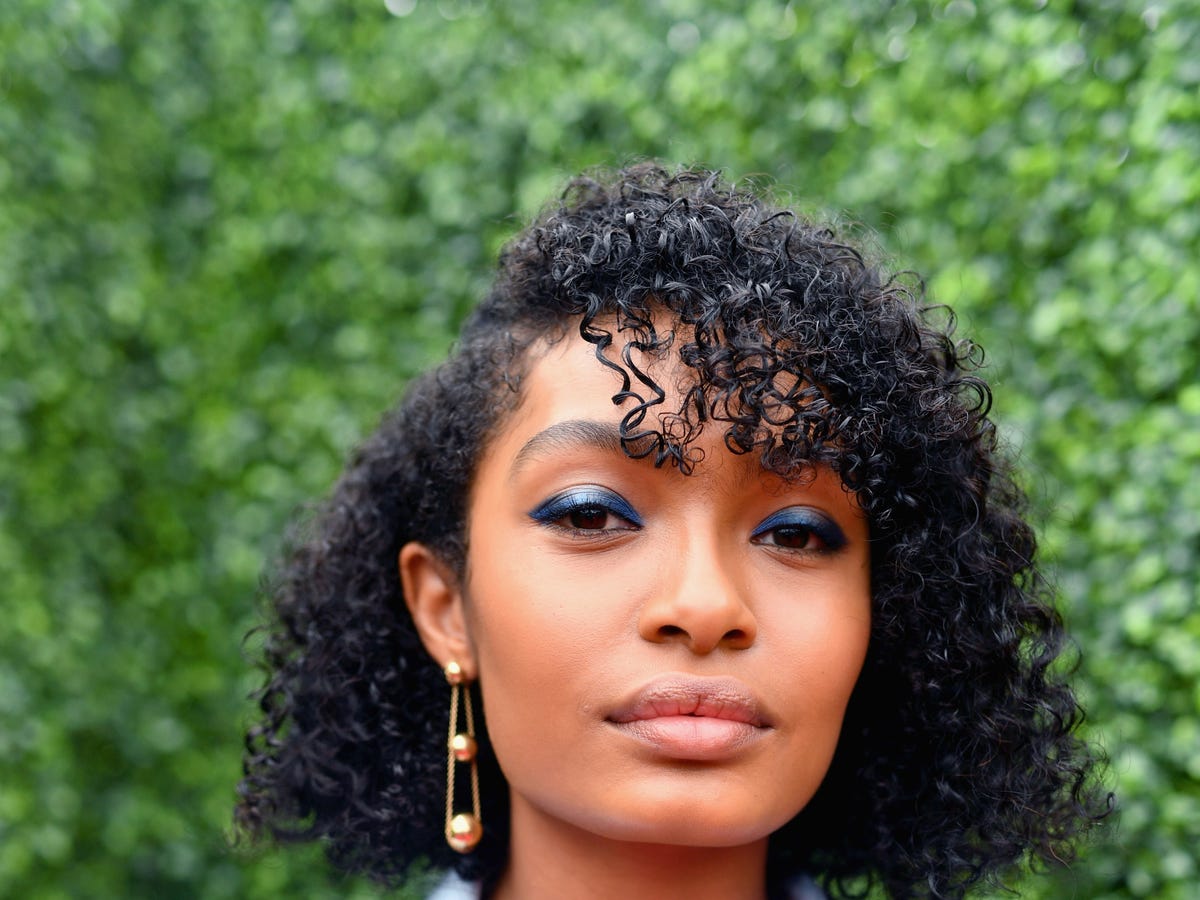 Asymmetrical Black Curly Bob With Side Bangs Asymmetrical Black Curly Bob With Side Bangs — Tight Curly Hairstyles 2027