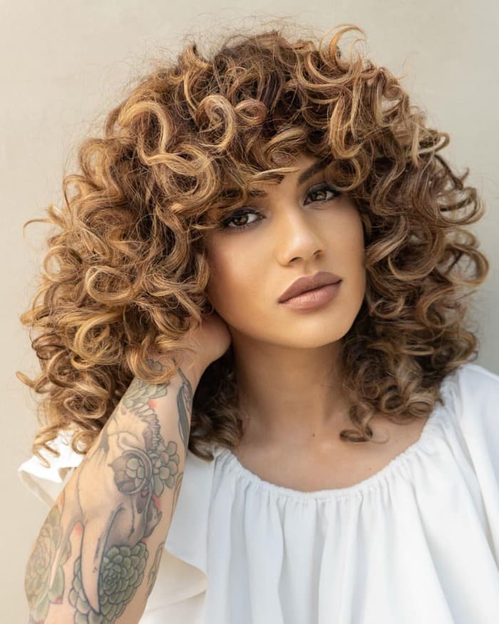 Honey Blonde Collarbone Shag With Curly Bangs Honey Blonde Collarbone Shag With Curly Bangs — Tight Curly Hairstyles 2027