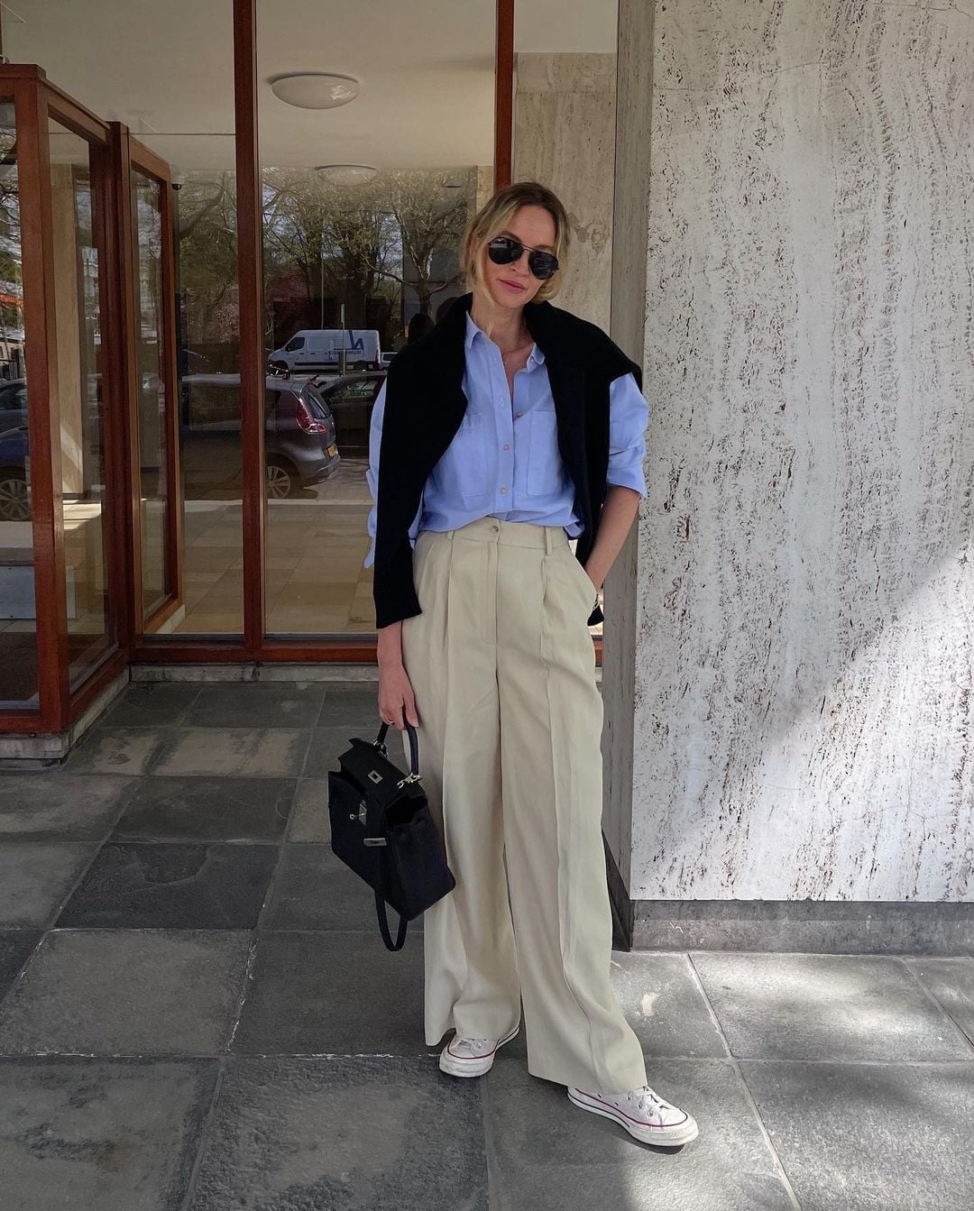 Beige Wide Leg Trousers With Light Blue Shirt And Black Sweater Beige Wide Leg Trousers With Light Blue Shirt And Black Sweater — Trousers Outfits 2027 with Blouse