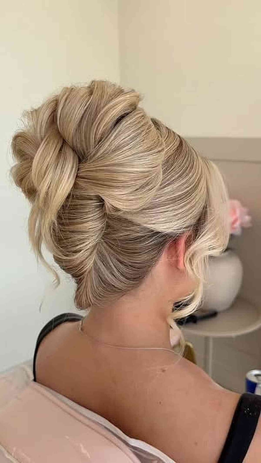 Voluminous Blonde High Twisted Bun With Loose Tendrils Voluminous Blonde High Twisted Bun With Loose Tendrils — Twisted Bun Hairstyles 2027