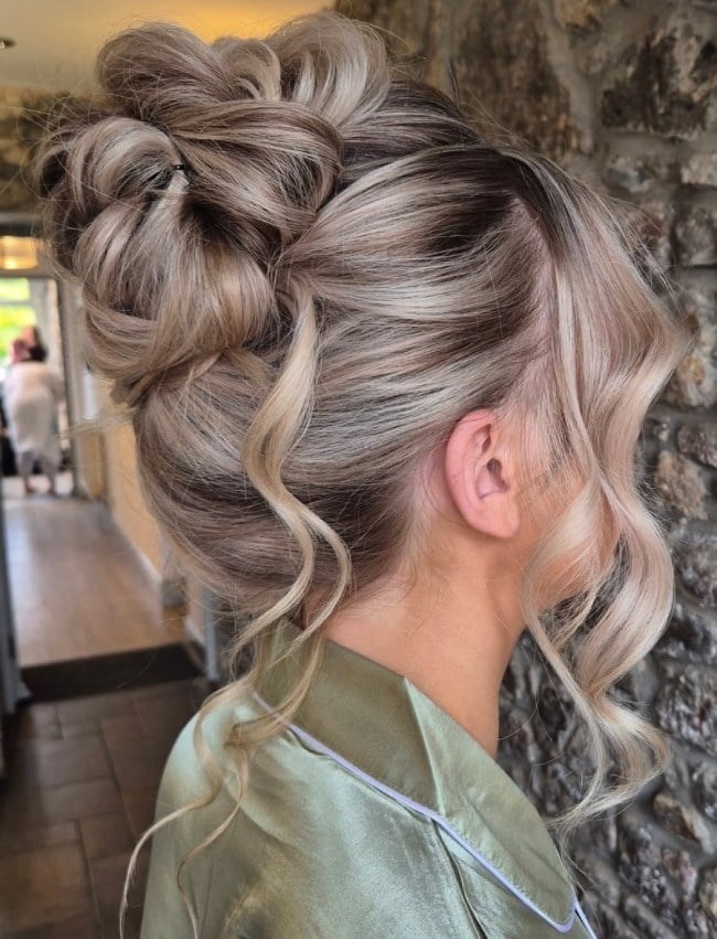 Voluminous Twisted Bun With Face-Framing Pieces Voluminous Twisted Bun With Face-Framing Pieces — Twisted Bun Hairstyles 2027