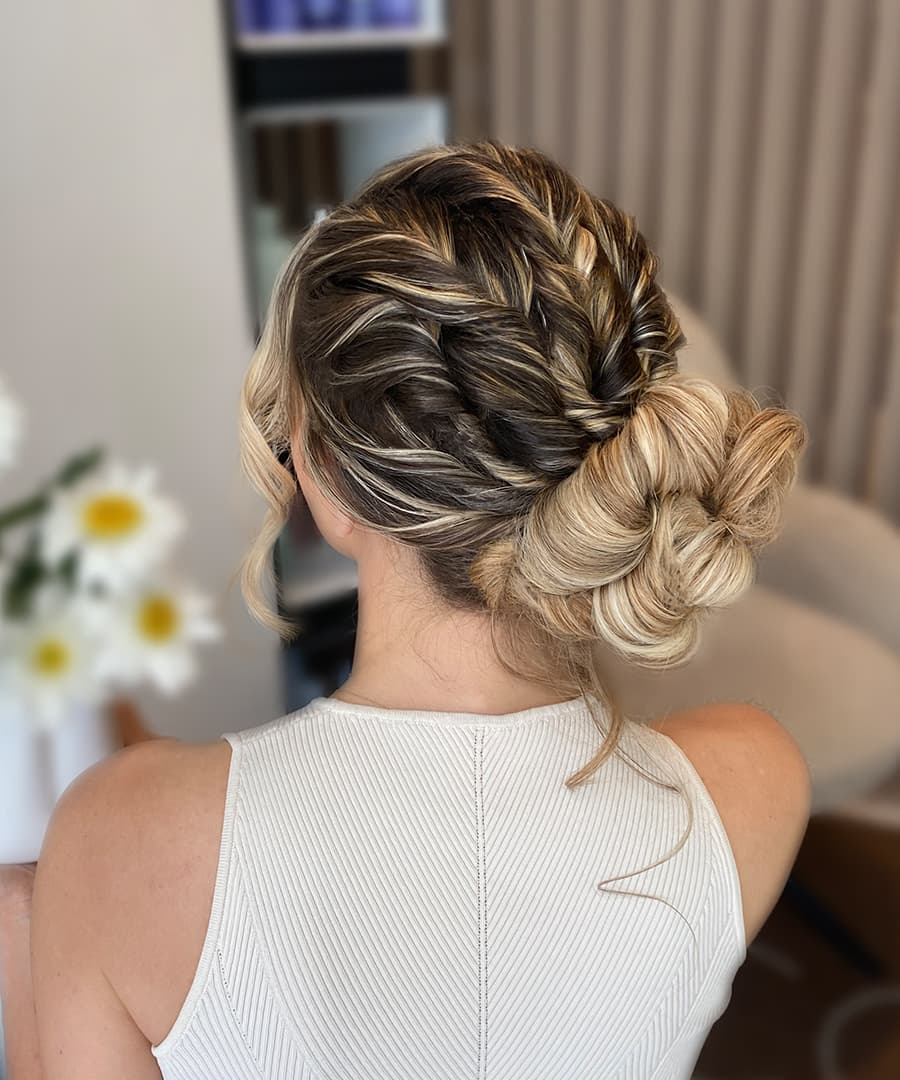 Sleek Dark Brown Low Twisted Bun With Wispy Strands Sleek Dark Brown Low Twisted Bun With Wispy Strands — Twisted Bun Hairstyles 2027