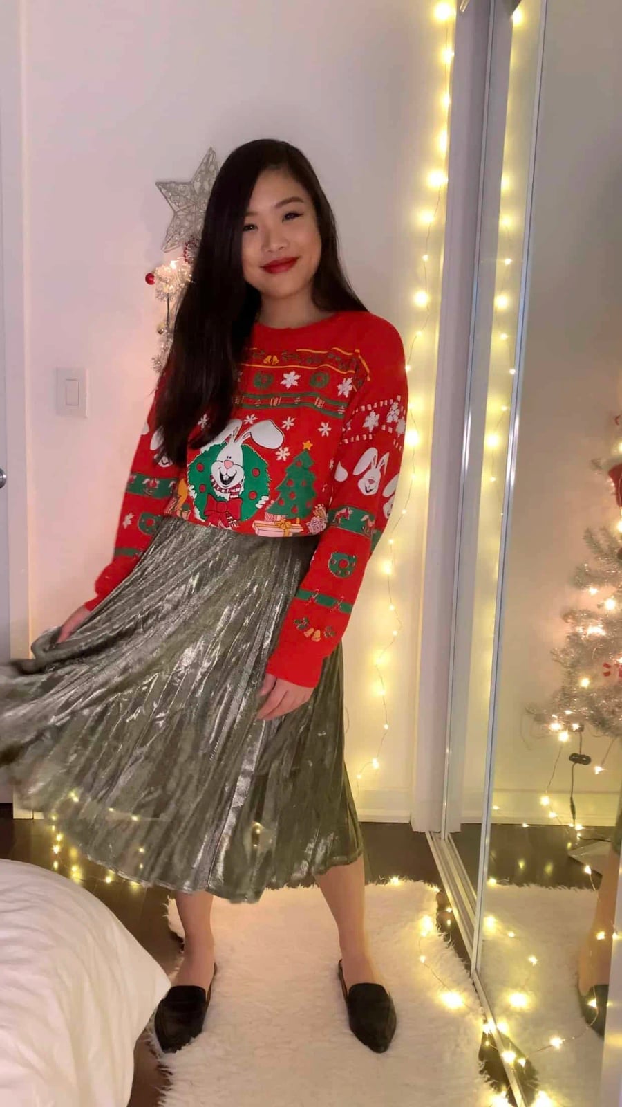 Cropped Graphic Sweater with Metallic Pleated Skirt — Ugly Sweater Party Outfits 2026