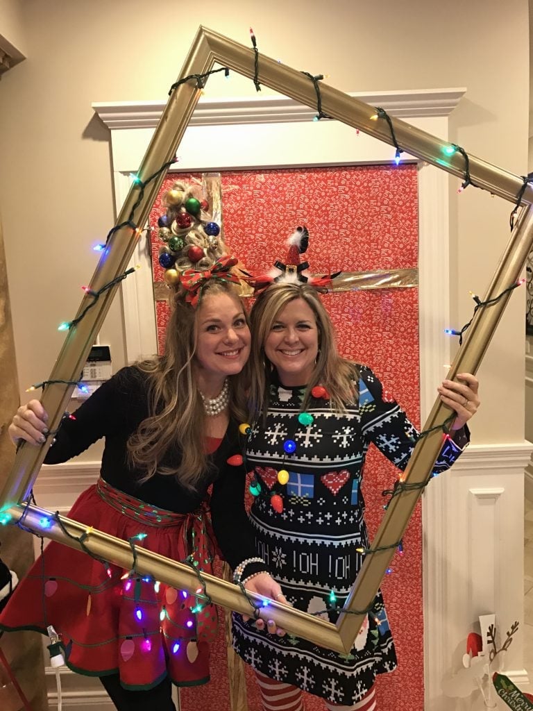 Festive Sweater Dress with Light-Up Ornaments and Striped Stockings — Ugly Sweater Party Outfits 2026