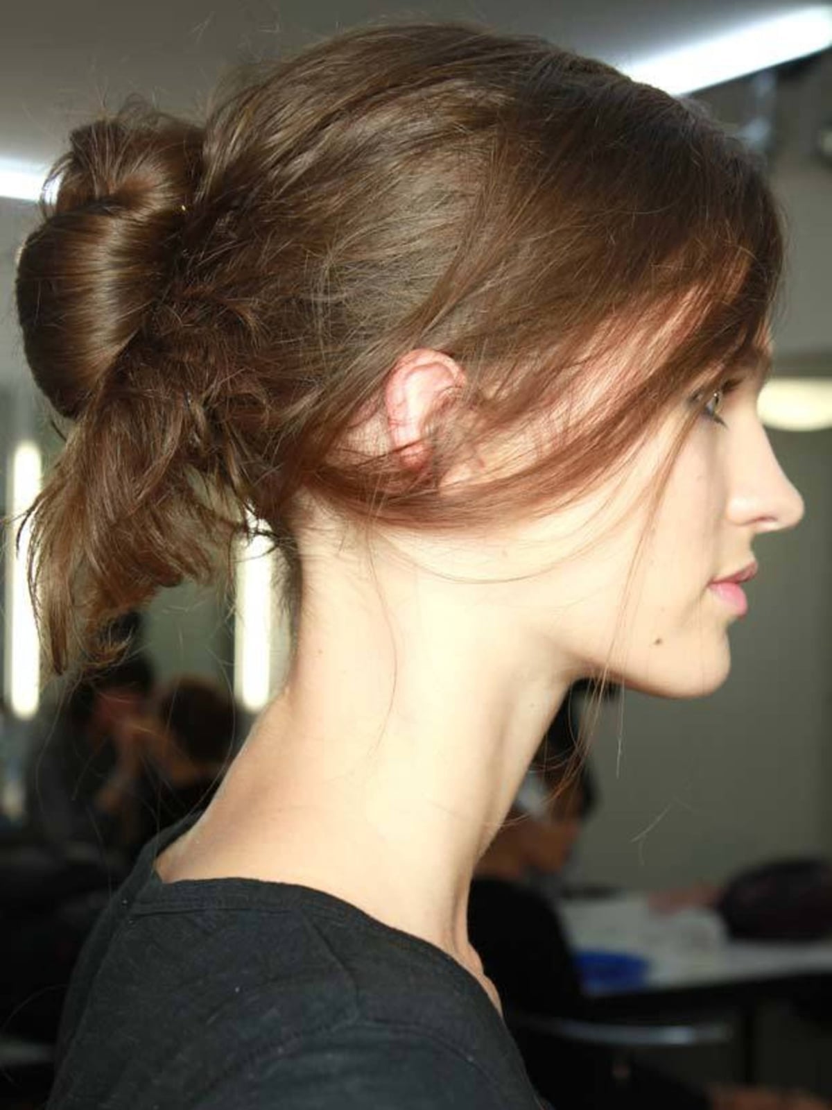 Collarbone Medium Brown Low Bun With Wispy Strands — Undone Hairstyles 2027