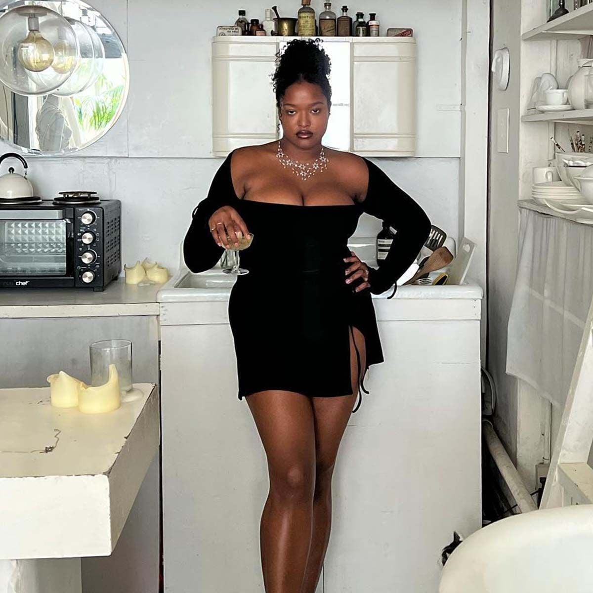 Black mini dress with side cut-outs and statement necklace Black mini dress with side cut-outs and statement necklace — Vegas Show Outfits 2027