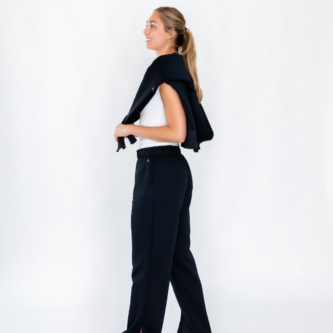 White Tank Top and Black Wide-Leg Sweatpants White Tank Top and Black Wide-Leg Sweatpants — Volleyball Outfits for Women 2027