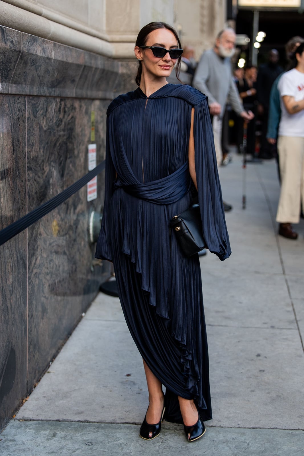 Navy blue pleated satin dress with draped cape sleeves Navy blue pleated satin dress with draped cape sleeves — Wedding Guest Outfits Vineyard 2027