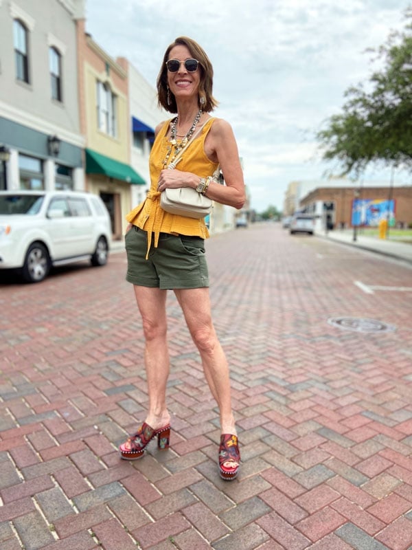 Olive green shorts and yellow peplum top with ornate wedge mules Olive green shorts and yellow peplum top with ornate wedge mules — Wedges Outfits 2027 with Shorts