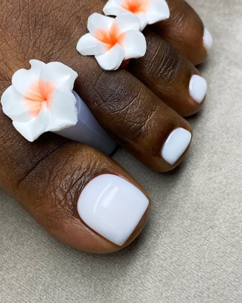 Opaque White Glossy Toenails with Floral Accents Opaque White Glossy Toenails with Floral Accents — White Toe Nails 2027