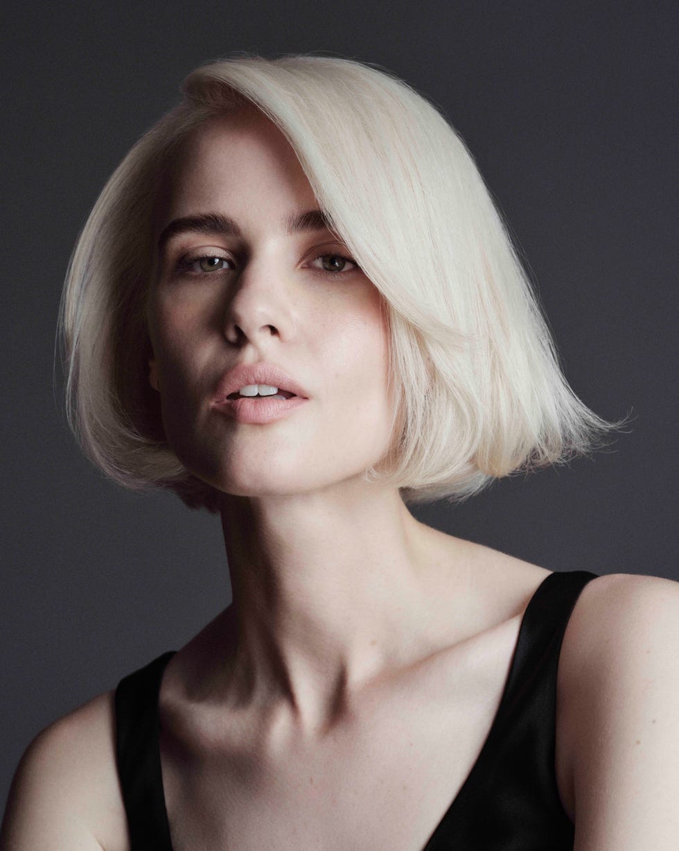Platinum Blonde Chin Length Bob With Deep Side Part — Winter Haircuts 2027 for Oval Faces