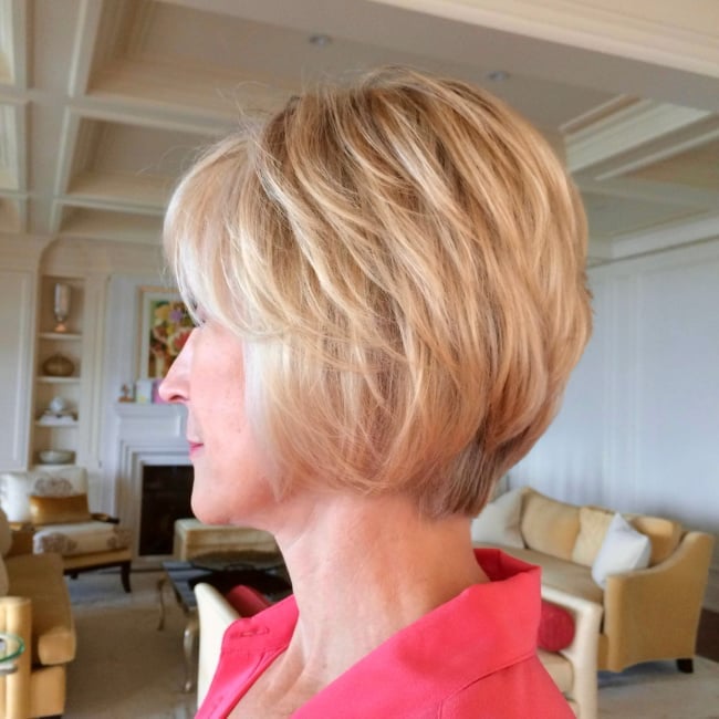 Blonde Chin Layered Bob With Side-Swept Bangs — Winter Haircuts 2027 for Oval Faces