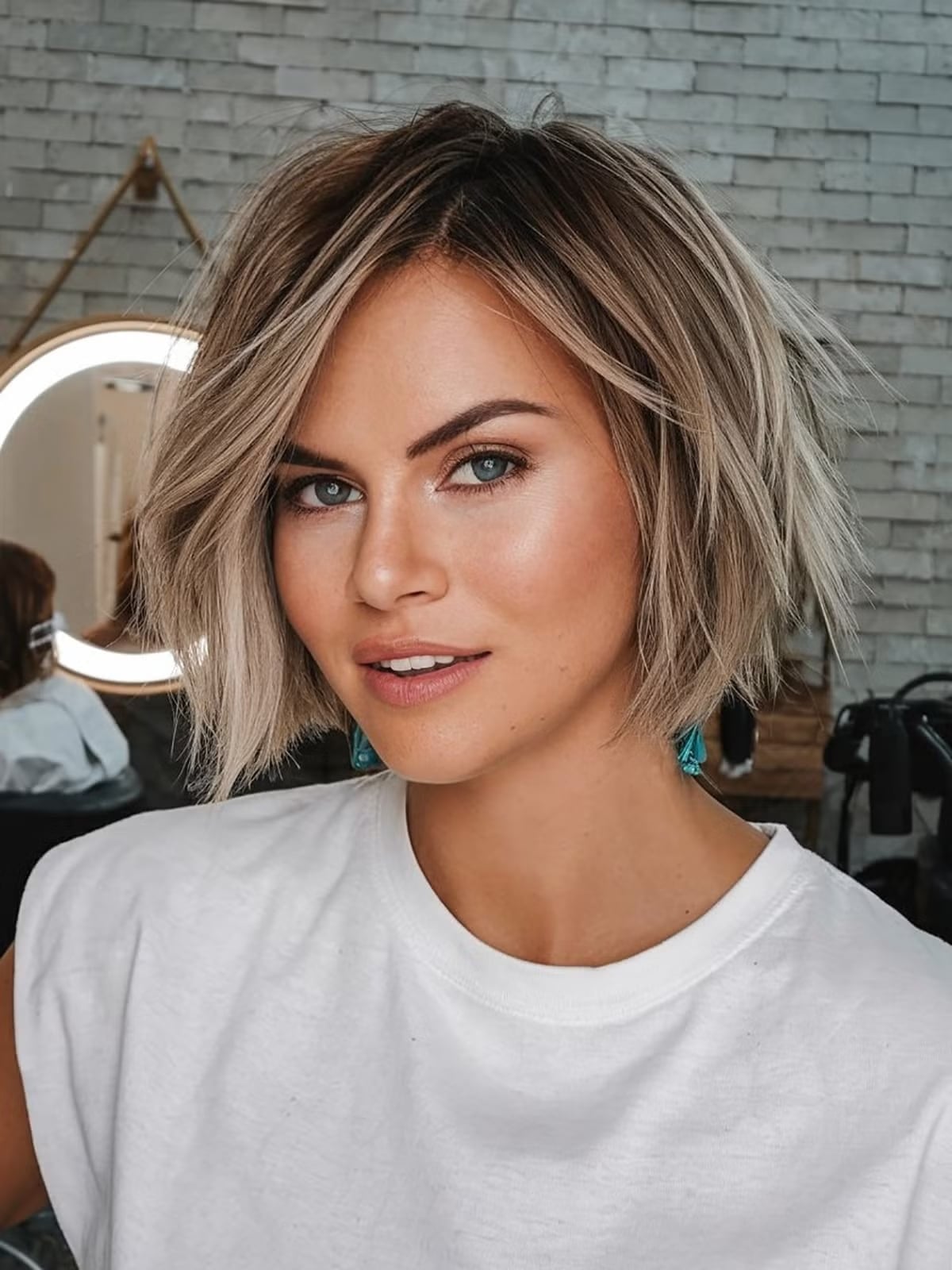 Ash Blonde Chin Pixie With Wispy Bangs — Winter Haircuts 2027 for Oval Faces