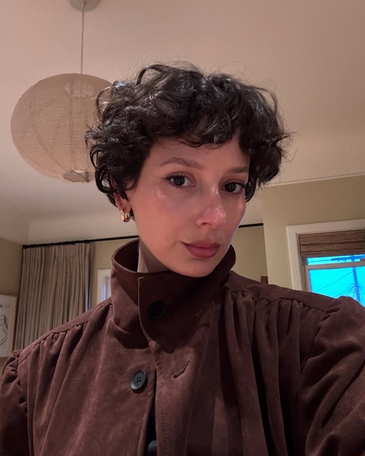 Short Dark Brown Pixie With Voluminous Curls Short Dark Brown Pixie With Voluminous Curls — Winter Hairstyles 2027 for Round Faces