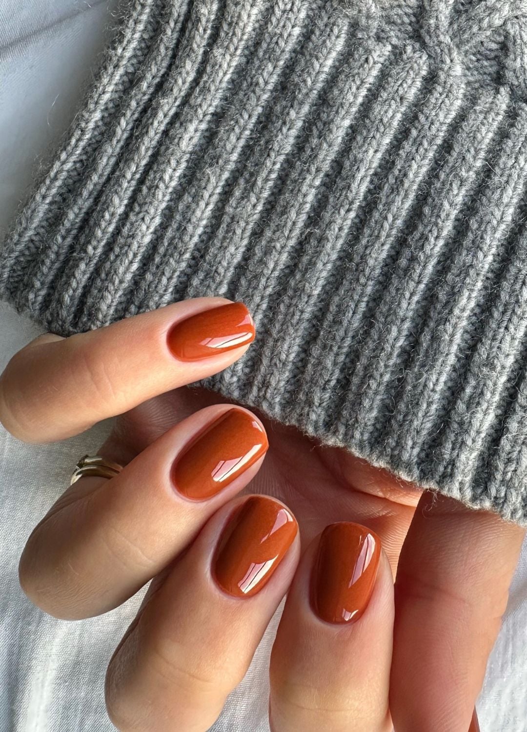 Glossy Warm Terracotta Short Oval Nails — Winter Nail Colors 2027 for Pale Skin