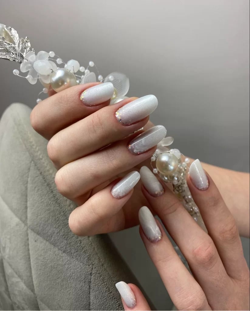 Shimmery Off-White Glitter Cuticle Accent Medium Oval Nails — Winter Nail Colors 2027 for Pale Skin