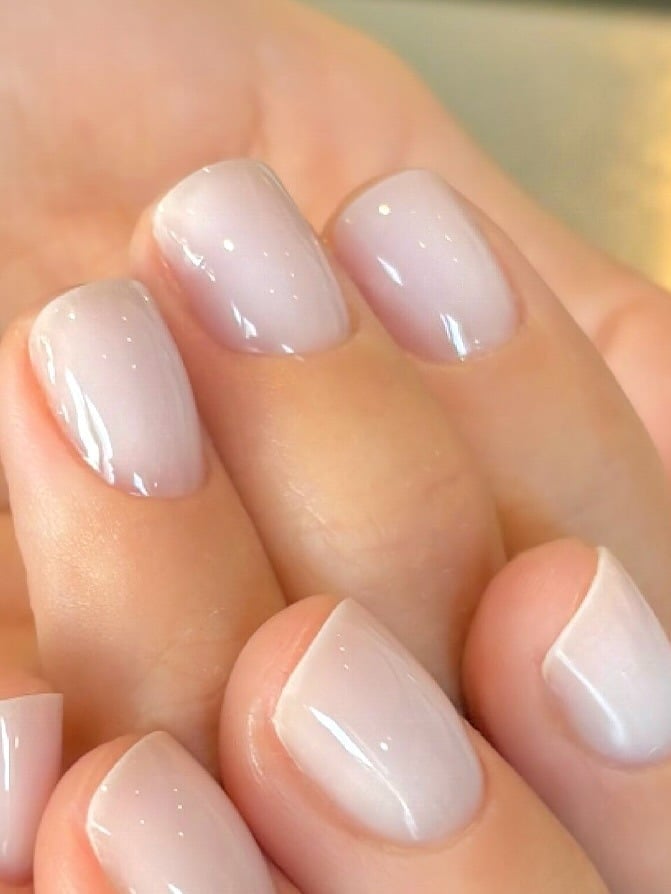 Glossy Sheer Milky Pink Short Almond Nails — Winter Nail Colors 2027 for Pale Skin