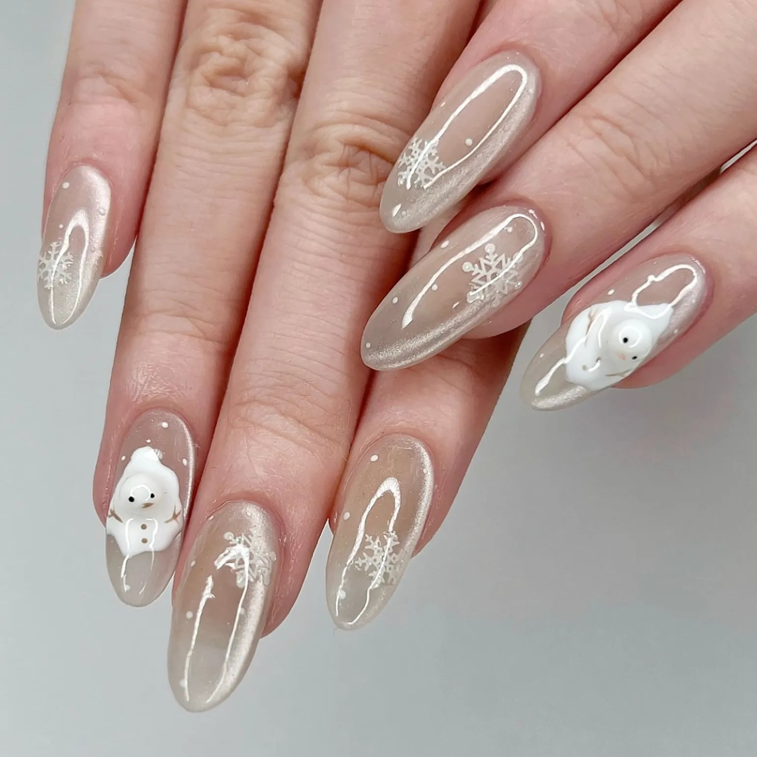 Sheer Beige Snowflake Snowman Stiletto Nails — Winter Nail Colors 2027 for Pale Skin