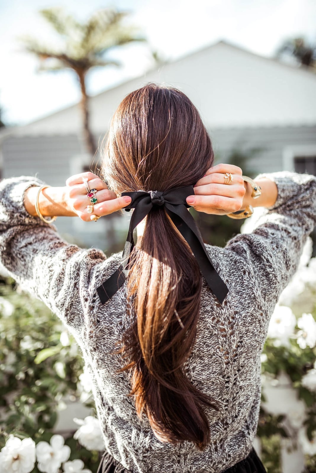 Sleek Ponytail With Black Ribbon Bow Sleek Ponytail With Black Ribbon Bow — Winter Ponytail Hairstyles 2027