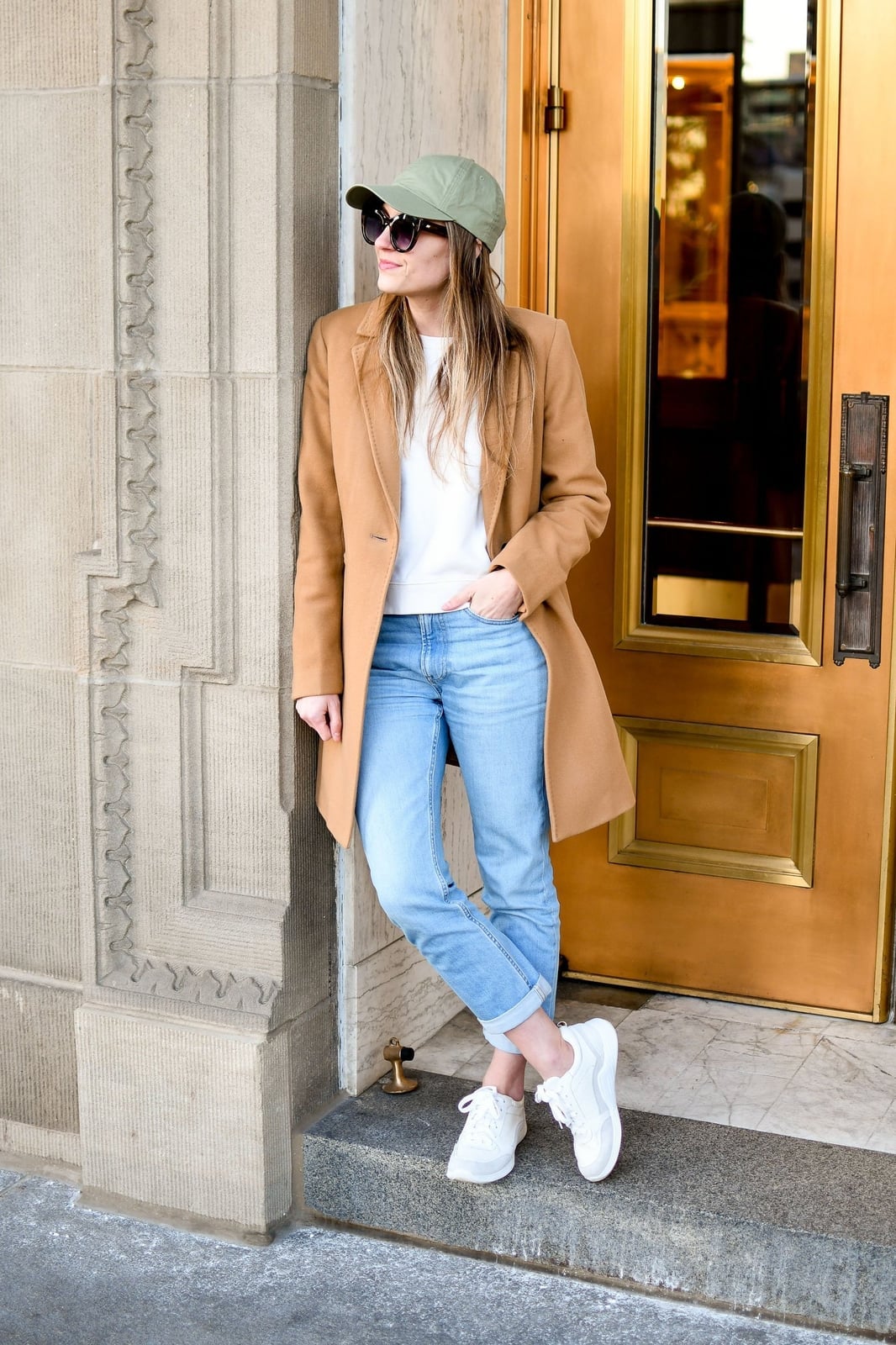 Camel wool coat over white tee and cuffed jeans Camel wool coat over white tee and cuffed jeans — Winter to Spring Transition Outfits 2027