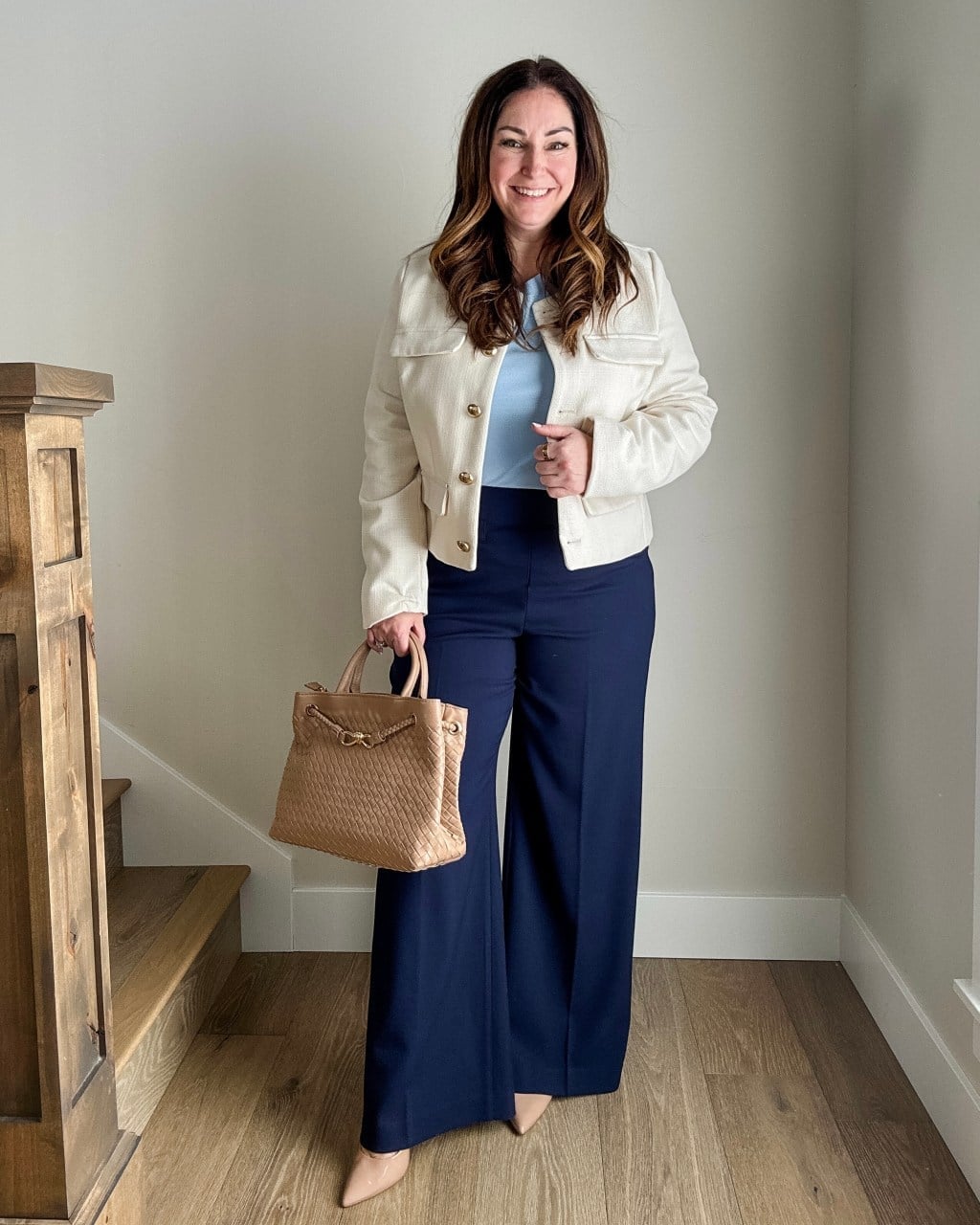 Cream cropped jacket over light blue top and navy wide leg trousers Cream cropped jacket over light blue top and navy wide leg trousers — Winter to Spring Transition Outfits 2027